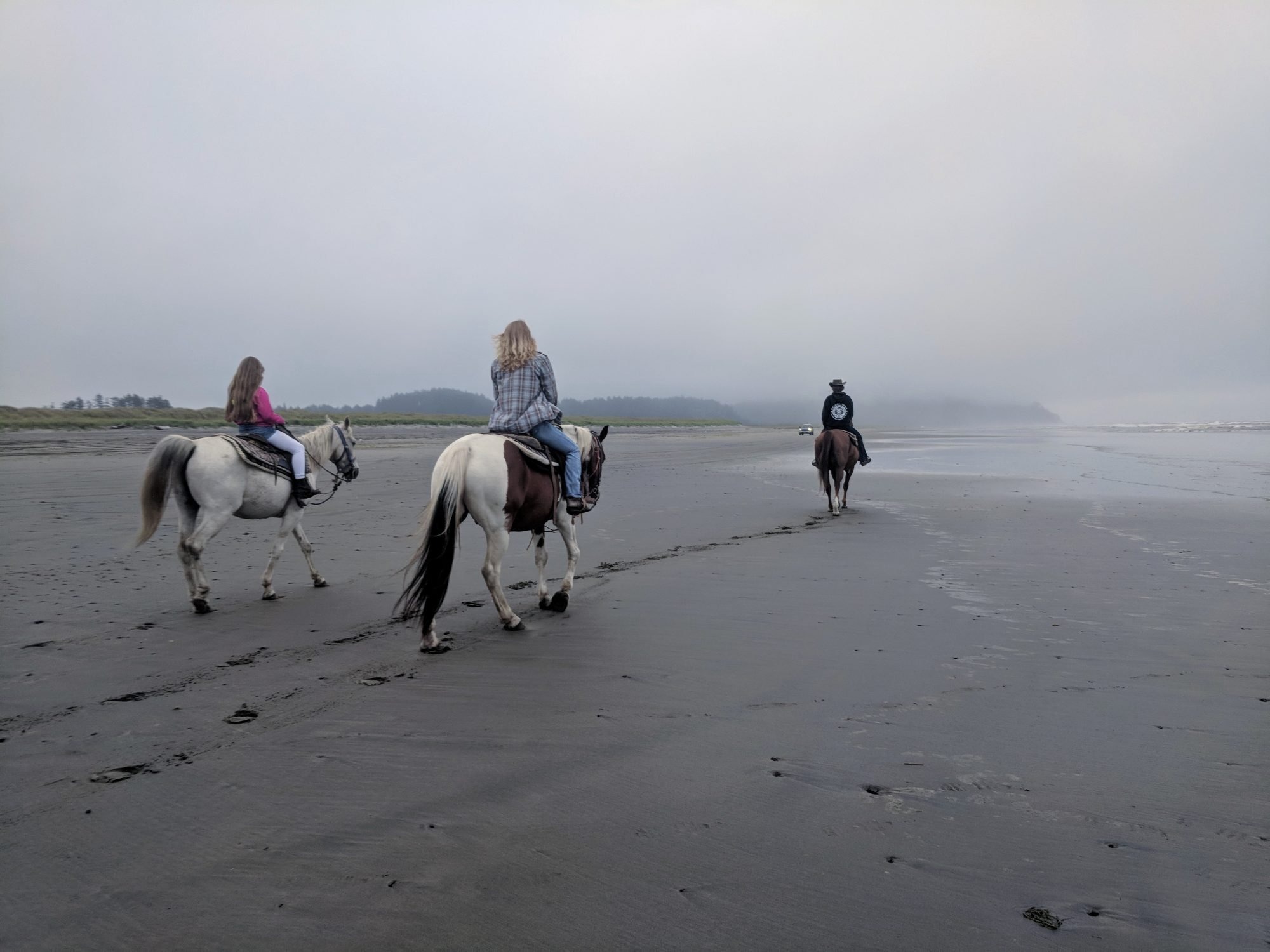 Horseback riding on the beach in Long Beach, WA, a fun outdoor beach activity for visitors looking for unique experiences.